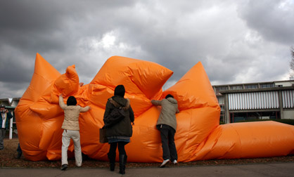 Big Blob Viewers piling on top of Big Blob iinflatable suit