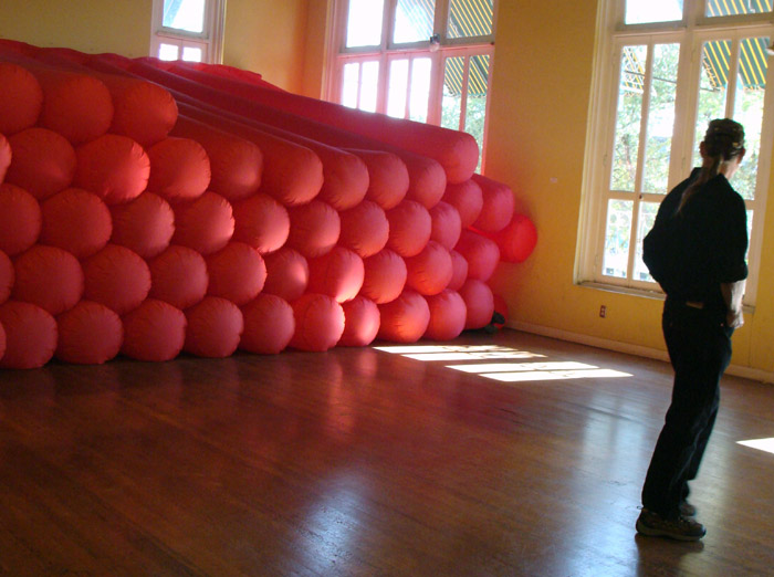 Stuffed Full Gallery viewer examines inflatable installation