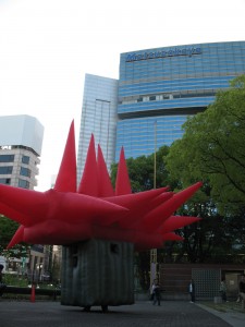 Big Red in Sakae Inflatable suit next to building