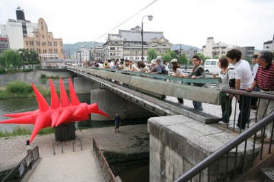 Inflatable suit about to sqeeze under bridge in Kyoto, Japan