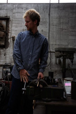 jimmy_kuehnle_metal_shop_nagoya Jimmy Kuehnle puts a metal pipe in a vise in Nagoya