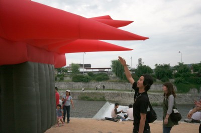 Big Red inflatable suit and spectators in Kyoto, Japan
